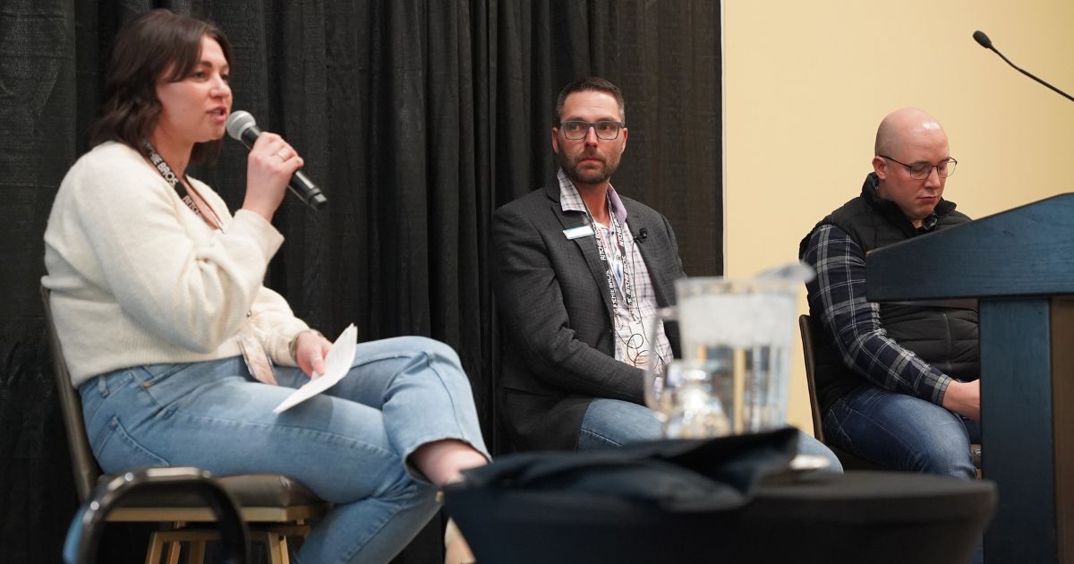 INDIGENOUS SUMMIT - AGRIBITION - CULTIVATOR - Three people sit on a stage discussing agriculture.