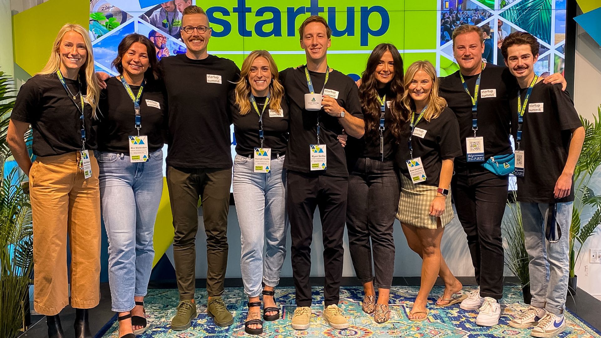 Cultivator team stand together infront of the 2022 Startup Summit stage