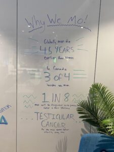 Facts about men's health are written on a white board to share more information about the importance of Movember.