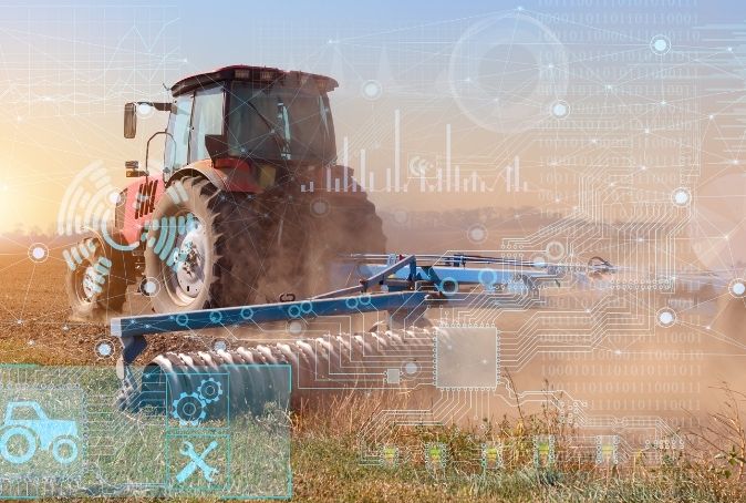 Farm equipment in field with technology icon overlay