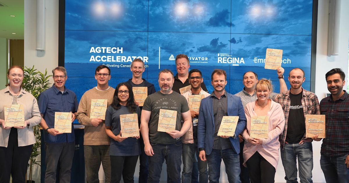 AGTECH ACCELERATOR - COHORT 1 founders stand togetehr holding their wooden plaques